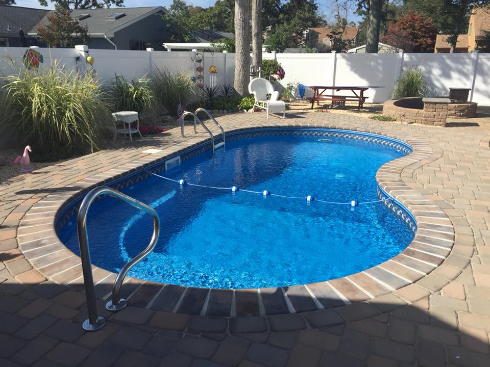 Custom backyard pool with landscaping